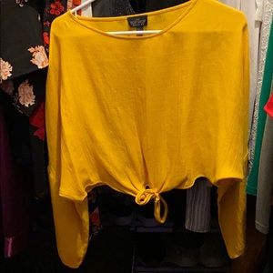 Super cute gold blouse.